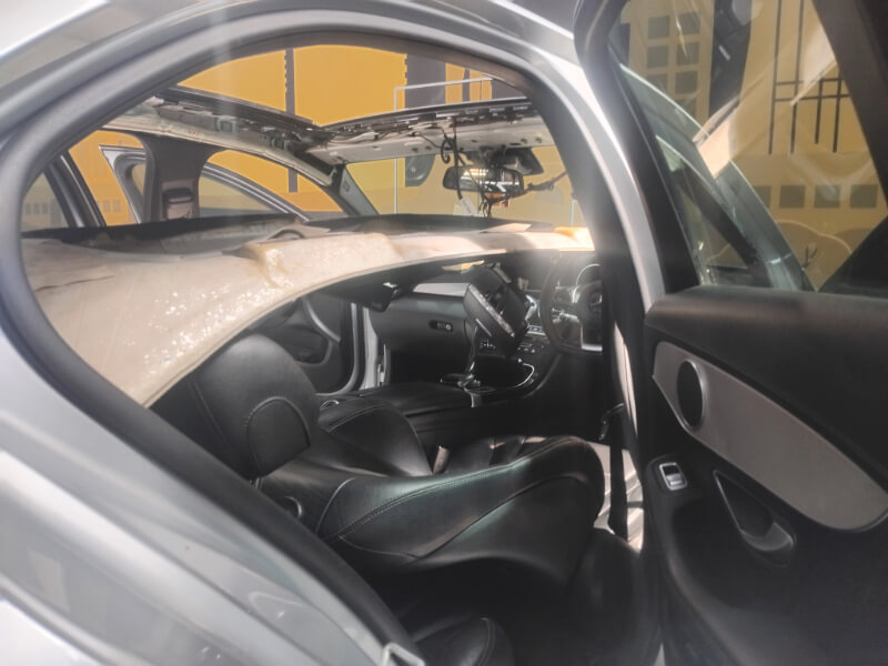 Stripping Mercedes Benz sunroof to repair mechanisms